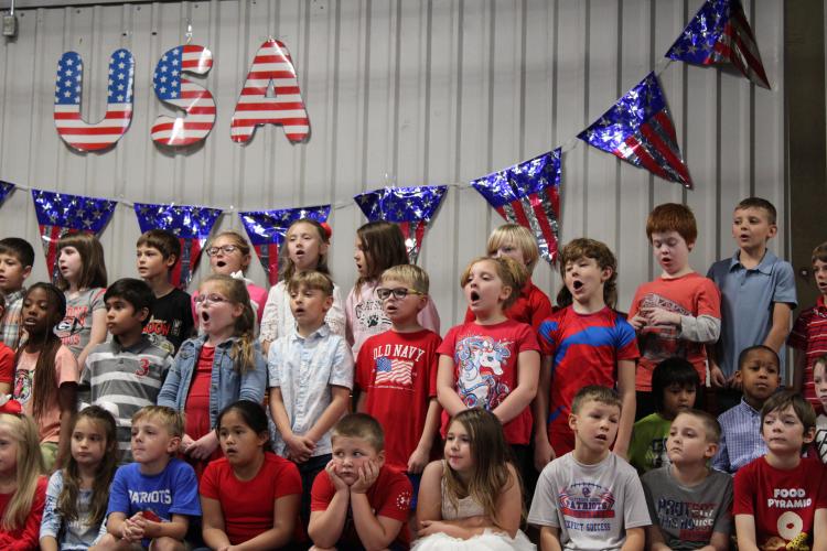 Second graders sang "God Bless America" as part of their Veterans Day Celebration. Last Friday, the performance included seven songs sang by the students at the primary school. (Caleb Baldwin/The Oglethorpe Echo)