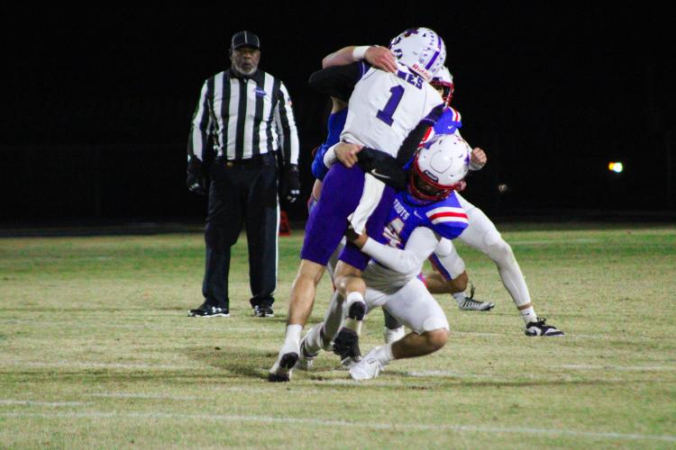 Oglethorpe County's Ashton Sexton (14) tackling Jasper County's Austin Young (1). The Patriots defeated the Hurricanes 35-28 on Friday, November 3. (Lauren Hill/The Oglethorpe Echo)
