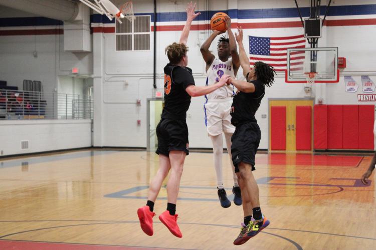 Javaun Pittard (3) attempts a 3-pointer in Oglethorpe County’s 72-68 victory over Hart County in a scrimmage on Nov. 9. Pittard averaged 18 points a game to lead the Patriots in scoring last year. (LAUREN HILL/THE OGLETHORPE ECHO)