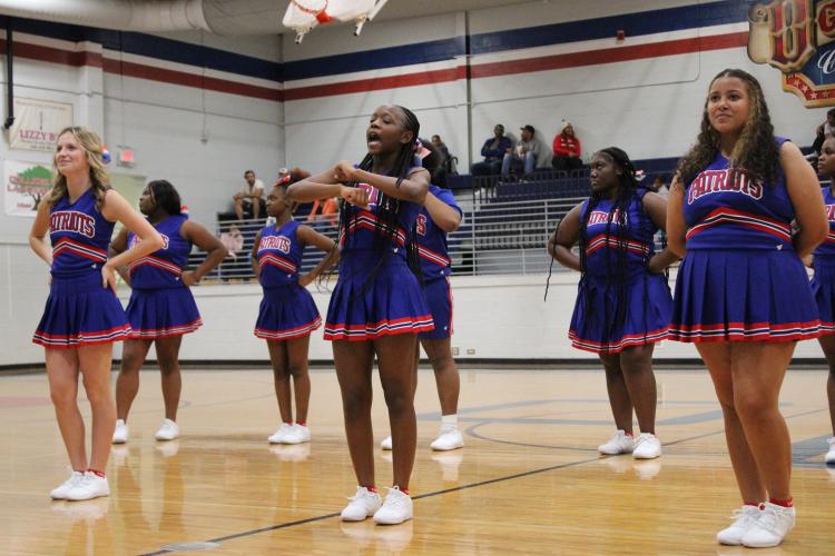 The OCHS basketball cheer team performs during halftime of the scrimmage against Hart County. The Patriots open the season in the Billy Wade Classic at Clarke Central on Nov. 20 and 21. (LAUREN HILL/THE OGLETHORPE ECHO)