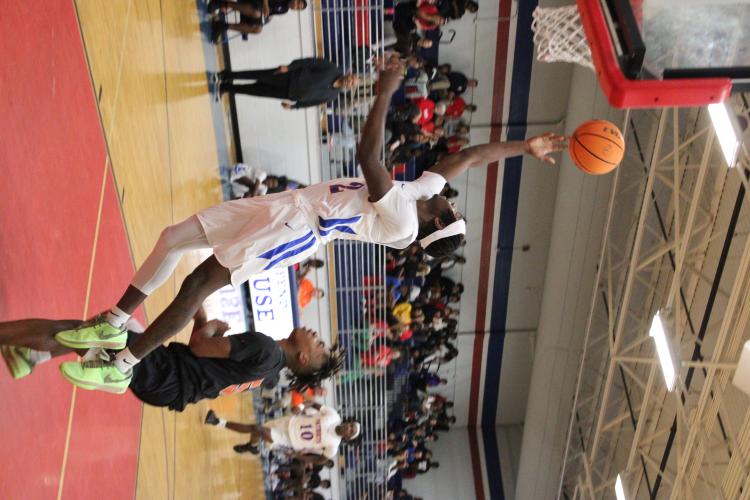 Jaelin Lumpkin (2) goes in for a layup to help OCHS defeat Hart County in a scrimmage. Lumpkin led the Patriots in steals last season. (LAUREN HILL/THE OGLETHORPE ECHO)