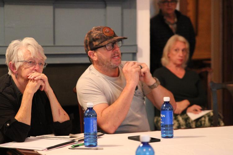 Lexington Mayor Craig Snow, seated beside local business owner Linda Parish, speaks at the downtown Lexington master plan kickoff meeting on Nov. 14 at the Presbyterian Manse. As mayor, one of Snow’s main focuses has been to redevelop downtown.