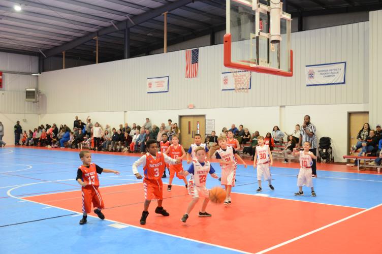 Crowds gather to watch a youth basketball game at the Oglethorpe County Recreation Department on Dec. 5. Stands on both courts in the gym were packed with parents and other attendees. Recreation Department staff say space is at a premium with continued growth in their athletic programs. (McCain Bracewell/The Oglethorpe Echo)