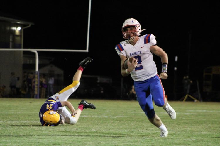 Oglethorpe County’s Jake Turner gains a portion of his 1,318 yards rushing this season on this carry in the victory over Athens Christian. Turner is pursuing scholarship offers to play football in college. (Lauren Hill/ The Oglethorpe Echo)