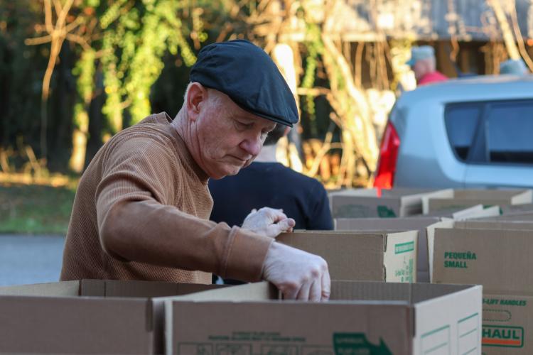 Steve Holloway, a volunteer, checks boxes of food during the monthly food pantry at Lexington Baptist Church. The church has held the food pantry for more than 20 years. (Samantha Hurley/The Oglethorpe Echo)