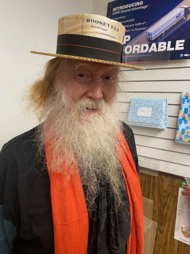 John Gingerich recently visited the Lexington Post Office wearing a straw  hat with “Roosevelt Reception Committee” printed on it. The lifetime col- lector said his most valuable piece is a silk ribbon that features pictures  of former President Martin Van Buren and his running mate. (Dink Nesmith/The Oglethorpe Echo)