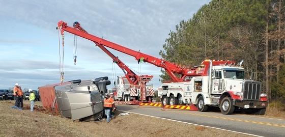 Mobile cranes and tow trucks were called in to remove the tractor-trailer that overturned and blocked Saxon Mattox Road on Monday morning. Another truck blocked Lexington-Carlton Road later that day.