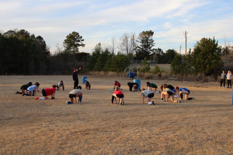 Oglethorpe Counties girls soccer team stretches after practice on Thursday, Feb. 1. The team has its first game on Feb. 9 against Madison County. (Photo/Owen Warden)