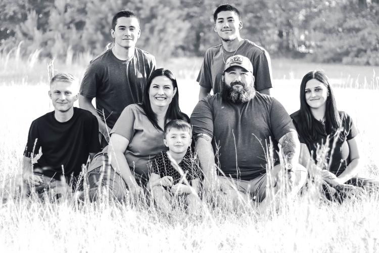 Erica Solomon (third from left) posing with her family and foreign exchange student Alejo Moreno (third from right). Solomon and Moreno's families have have remained in contact since he went back to Spain in June. (Submitted photo)