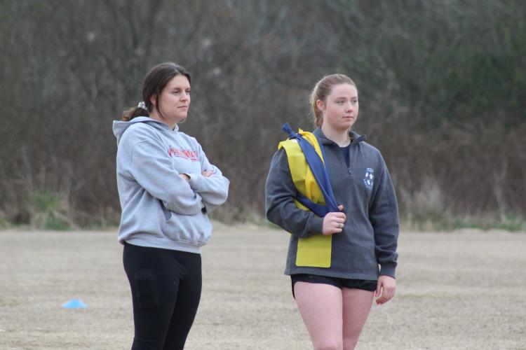 Alex Orlowsky and Taylor Doherty, former OCHS soccer players, now serve as volunteer assistants for coach Erich Forschler. (Samuel Higgs/The Oglethorpe Echo)