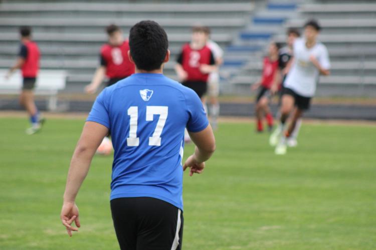 Armando Padilla watches a drill at practice on Feb. 16, 2024. (Samuel Higgs/The Oglethorpe Echo)