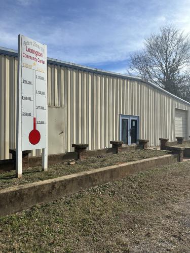 The fundraiser thermometer outside the Macon Coil building has been filled in to show that $65,000 has been raised to turn the facility into the Lexington Community Center. The goal is $200,000. (Jordan Howard/The Oglethorpe Echo)