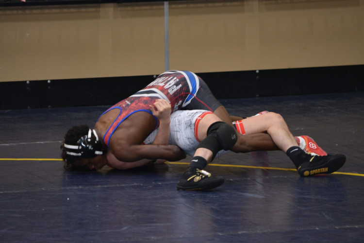 Freshman Paris Crowder pins his opponent on the way to a finals appearance at sectionals. (Submitted Photo)