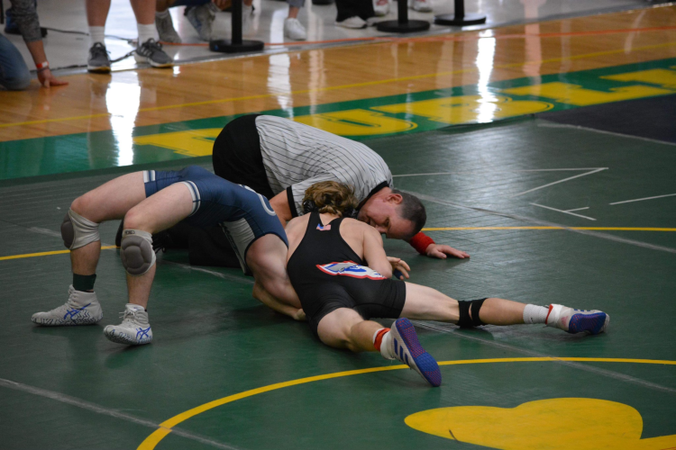 Rylee Clark pins his opponent at sectionals. (Submitted Photo)