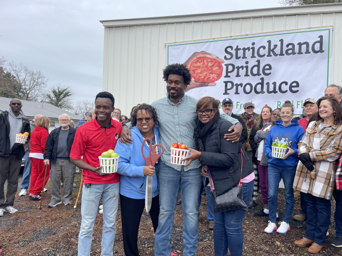 Williamson Sintyl (from left), Terri Strickland, Kendall Strickland and Yolanda Strickland celebrate the relocation and grand opening of Strickland Pride Produce on Feb. 5, 2024. Yolanda Strickland, mother of Kendall Strickland, was proud to see her son bring his passion for agriculture to the store's new location. (Margaux Binder/The Oglethorpe Echo)