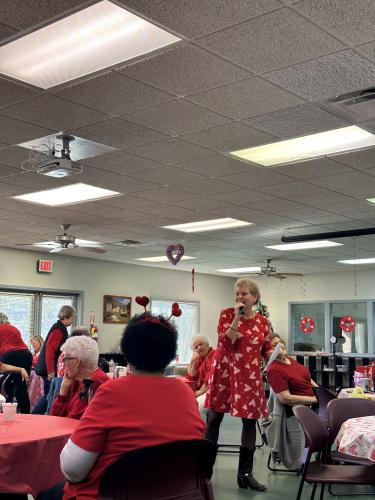 Debbie Winsett tells jokes and riddles to senior citizens at the Red and White Ball. The event was hosted at the The Oglethorpe County Senior Citizens Center and had over 30 participants. (Lily Murphy/Oglethorpe Echo).