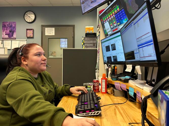 Oglethorpe County 911 dispatcher Amelia Priest surveys her workstation at the Oglethorpe County Sheriff's Department on Feb. 2, 2024. (Photo/Zeke Palermo)