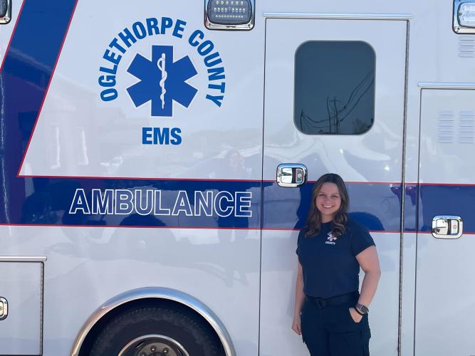Advanced EMT Taylor Eidson stands in front of an Oglethorpe County ambulance. (SUBMITTED PHOTO)