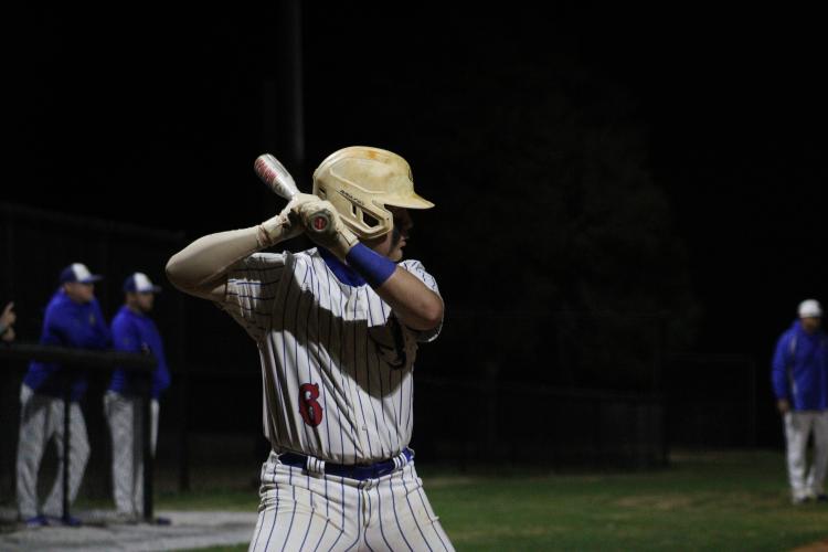 Oglethorpe County's Jacob Sass prepares for an upcoming pitch against Lake Oconee Academy on Feb. 29. (Photo/Owen Warden)