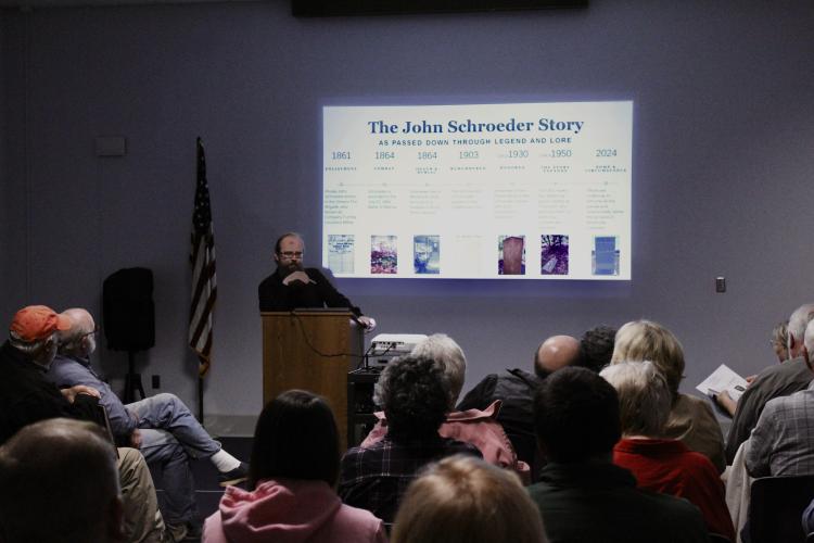 Jonathan Scott talks at a Historic Oglethorpe meeting, debunking the story surrounding Confederate soldier John Schroeder. Schroeder is said to be buried in Winterville. Michael Johnson/The Oglethorpe Echo