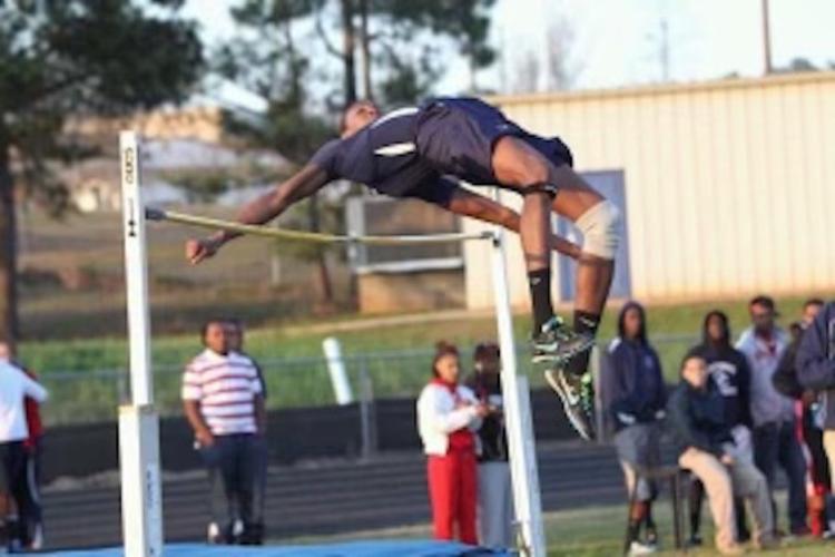Freeman competing in the high jump at Oglethorpe County