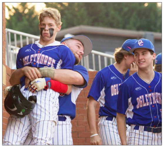 Evans Wilkins is lifted off the ground by a teammate in the Oglethorpe County baseball team’s game at North Oconee last week. Wilkins had two hits and scored two runs in the 6-4 loss. (Woody Loftin/For The Oglethorpe Echo)