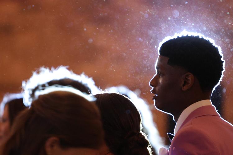 Ty Burgess is illuminated by a strobe light during the Oglethorpe County High School Prom at Historic Smithonia Farm in Colbert, Georgia on April 20, 2024. (Photo/Jim Bass)