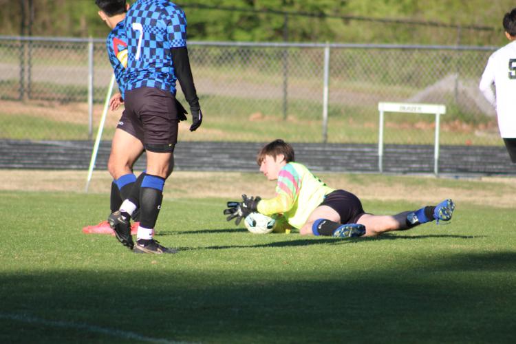 Oglethorpe County goalie Bailey Abrams dives on the ball to stop a Valdosta scoring threat in the Patriots’ 2-1 loss on April 5. OCHS can clinch the region’s top seed with a win over Jasper County on Thursday. (Photo/Owen Warden)