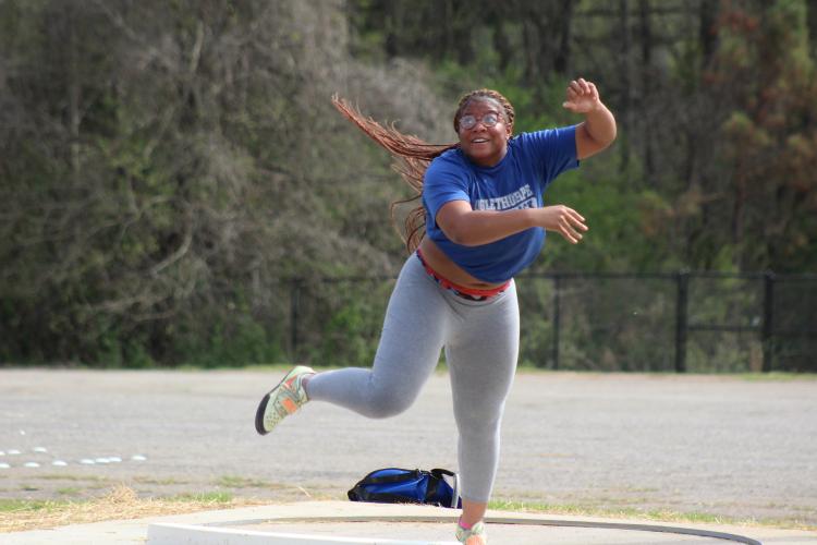 Zy’Kieria Edwards works on throwing the shot during Oglethorpe County track practice last week. She finished fifth in Class A Division I last spring and has a goal to throw at least 40 feet this year. (Samuel Higgs/The Oglethorpe Echo)