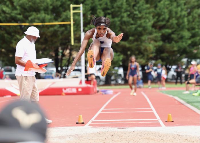 Denim Goddard soars on her way to winning the Class A Division I long jump for the second consecutive year. Goddard won two long jump and two triple jump titles the past two years. (Submitted Photo)