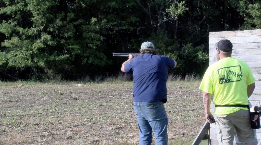 Oglethorpe County 4-H shotgun team member Henry Throne takes aim, alongside coach Gavin Hokanson during practice on May 7. 4-H shotgun coaches are required to renew their coaching certification each year. (Jack Keys/The Oglethorpe Echo)