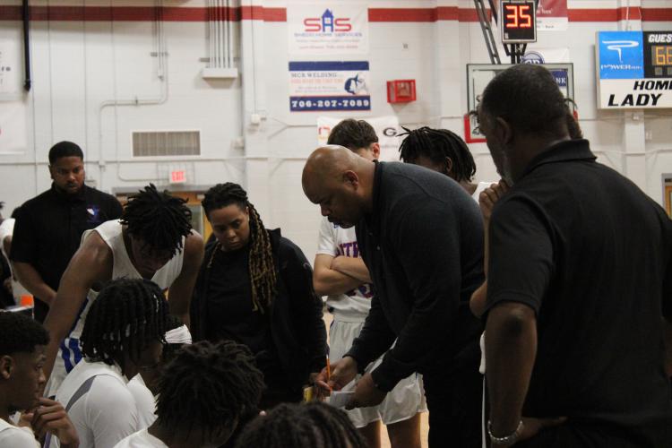 Brown drawing and teaching plays to his team during a third-quarter timeout during a scrimmage on Thursday, Nov. 9, 2023. (Lauren Hill/The Oglethorpe Echo)
