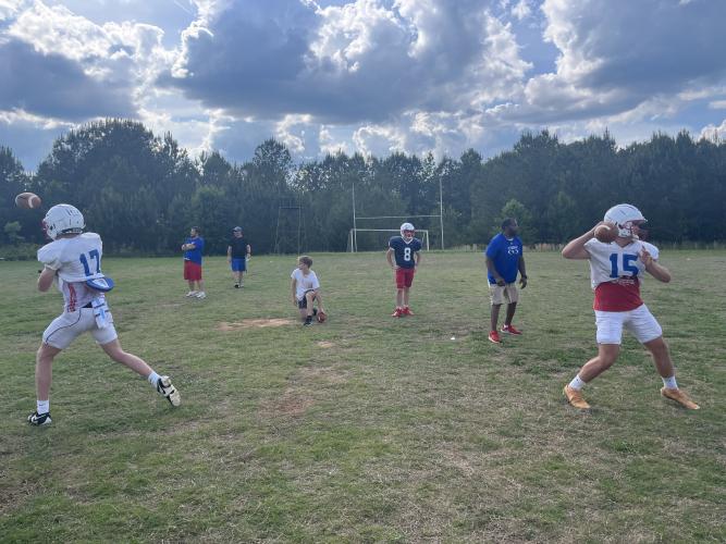 Quarterbacks Hunter Hall and Jacob Sass practice throwing screen routes during practice. (Hank Tatum/The Oglethorpe Echo)
