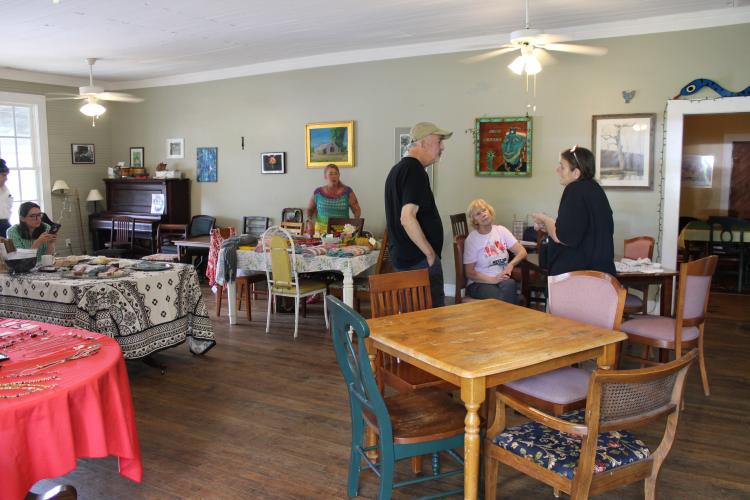 Locals gather at the Friends of the Oglethorpe Library book sale and art show at No. 3 Railroad on May 4, 2024. (Photo/Michael Johnson)