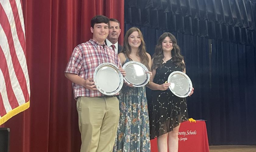 Honorarian Nathan Wilson (from left), salutatorian Allyson Kelley-Morris and valedictorian Macie McDaniel, with OCHS Principal Bill Sampson, were honored at Senior Honors Night on Tuesday. McDaniel and Kelley-Morris plan to attend UGA, and Wilson is heading to Georgia Tech.