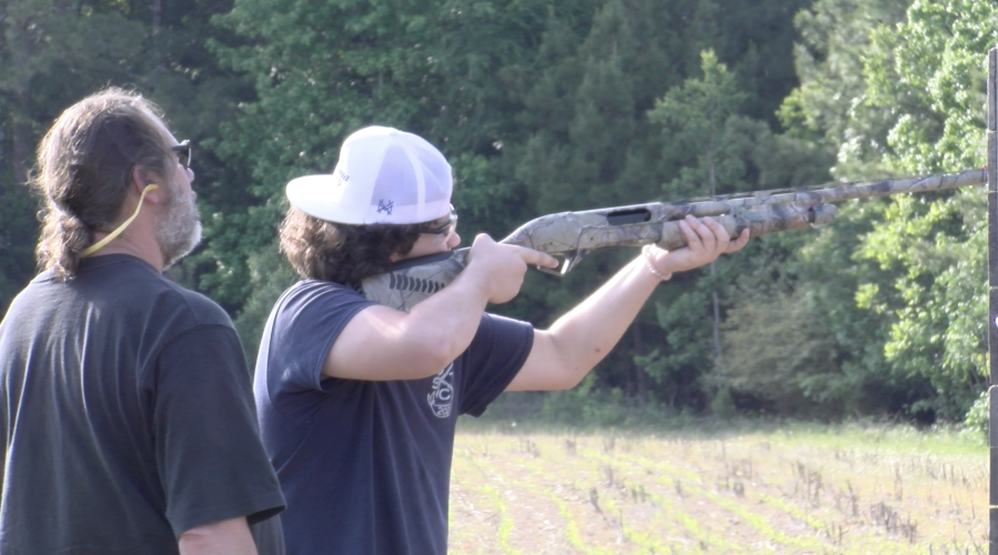 Oglethorpe County 4-H shotgun team member Jaden Hayes takes aim, alongside coach Dean Langford during practice on May 7. 4-H shotgun coaches are required to renew their coaching certification each year. (Jack Keys/The Oglethorpe Echo)