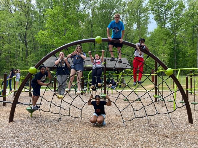 Ms. Atao's connections class participated in many activities, such as playing on the jungle gym on their camping trip to Sweetwater Creek State Park on the weekend of April 19. (Photo/ Turley Howard)