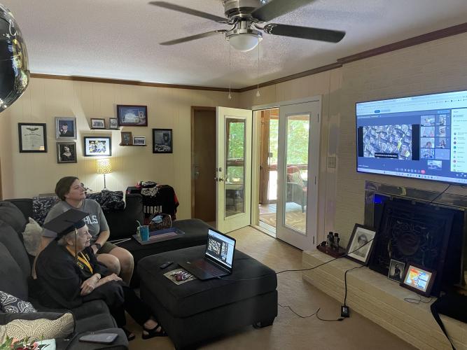 Mary Foley watches the University of Missouri's College of Arts and Science’s graduation ceremony alongside her daughter-in-law Emma Foley on Saturday. Mary Foley started college in 1950 and graduated 74 years later. (Jack Keys/The Oglethorpe Echo)