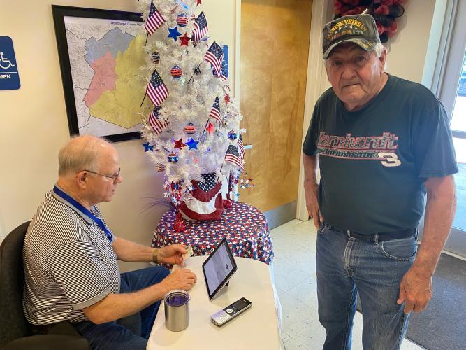 Only 13% voted had voted by 9 a.m., including 50 in Lexington in the first two hours after the polls opened. George Gray checks in Ronnie Doolittle said, “I will be back in November.” (Dink Nesmith)