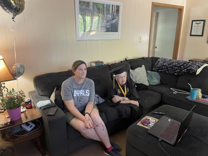 Mary Foley watches the commencement ceremony for University of Missouri's College of Arts and Sciences on May 11, alongside her daughter-in-law Emma. (Jack Keys/The Oglethorpe Echo)
