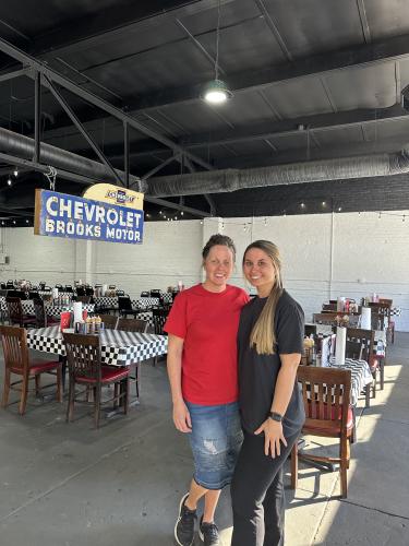 Ashtyn Allen (right) and Amber Smith (left) pose in the restaurant's main room. Allen has been with the restaurant since it opened and Smith started working there in November. (Lily Murphy/Oglethorpe Echo)