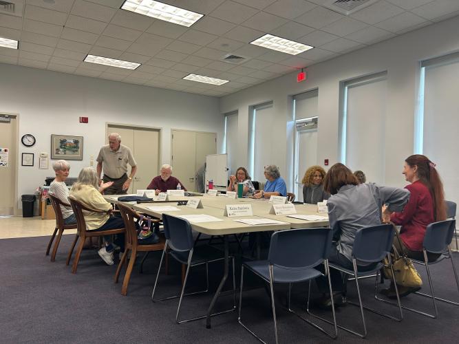 The Oglethorpe County Library Board of Trustees and guests discuss the controversial book "All Boys Aren't Blue" on May 23. The trustees voted 6-0 to move the book from the young adult to adult section of the library. (Zeke Palermo/The Oglethorpe Echo)