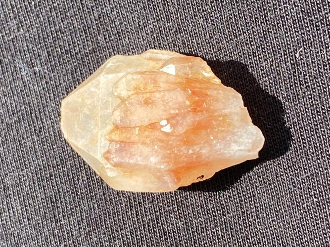 Among the crystals in Ron Brown's collection is a quartz with hematite inclusions, giving the normally clear crystal a red hue. (Submitted photo)