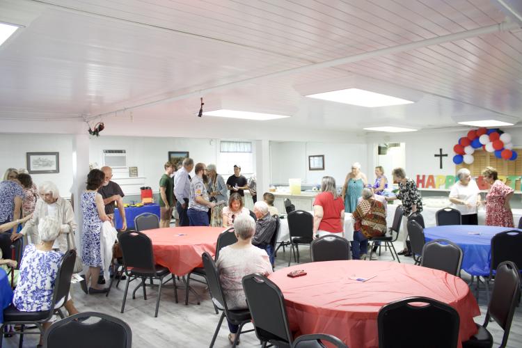 Friends and family fill the fellowship hall at Winterville United Methodist Church on June 8 for Forrest Neely’s 100th birthday party. Neely said: “I’ll tell everybody this: Live today because you’re here.” (Wyatt Meyer/The Oglethorpe Echo)