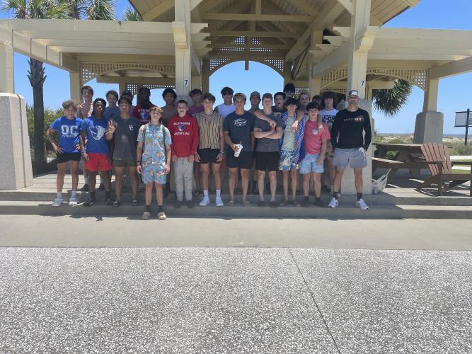 Steve Mason (right) and 23 of his high school wrestlers stopped at Jekyll Island Beach before heading to the Southern Hospitality Wrestling Camp at Camden County high school. (Submitted Photo)