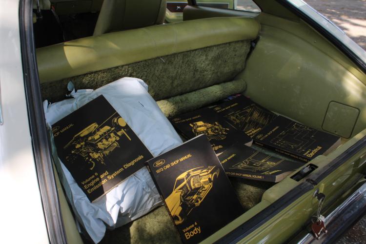 Donald Chandler still keeps the original manual books for the 51-year-old car. (Sarah Coyne/The Oglethorpe Echo)