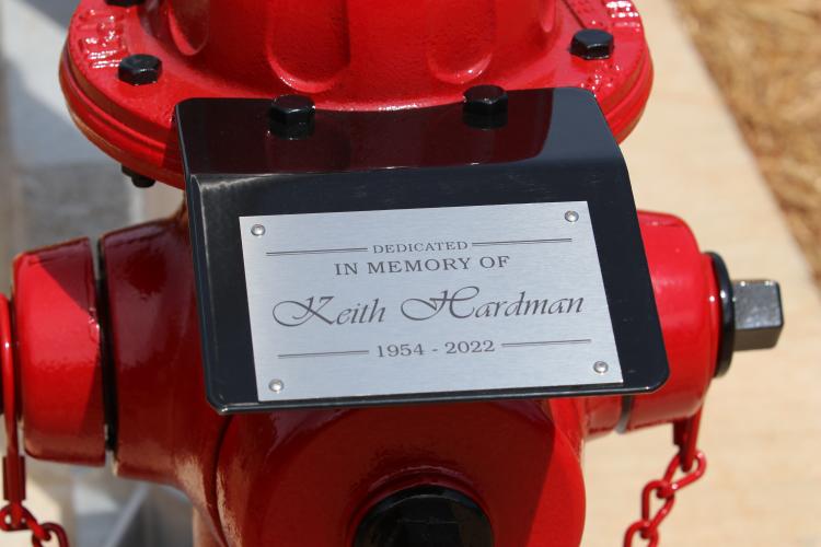 The new flagpole was dedicated to Keith Hardman, who volunteered with the Arnoldsville fire department for seven years. (Torin Smith/The Oglethorpe Echo)