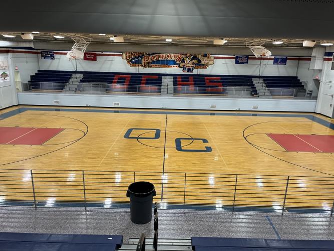 The old "OC" lettermark at center court wasn’t OCHS’ actual logo, so director of operations Paul Thiel wanted to replace it with something to better represent the school when the floor was refinished earlier this summer. (Submitted Photo)