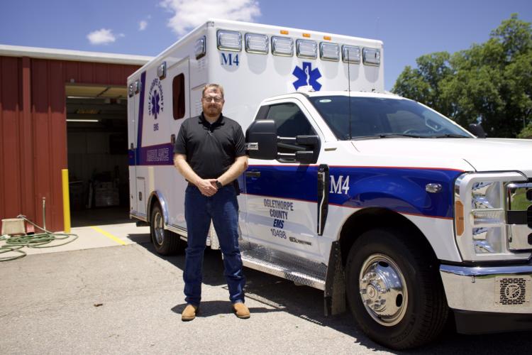 Oglethorpe County Emergency Medical Services Deputy Director Josh Robinson stands outside the new ambulance, M4, which was certified by the state last week and is scheduled to go into service. EMS tries to buy a new ambulance every other year. (Wyatt Meyer/The Oglethorpe Echo)