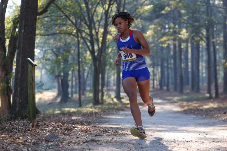 Oglethorpe County Sydnie Henderson rounds a bend on her way to winning the girls region title with a time of 20:07 at Social Circle last fall. She returns for her senior season to lead a deep girls team. (Cassidy Hettesheimer/The Oglethorpe Echo)
